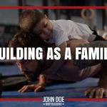 man doing a push-up with son on his back